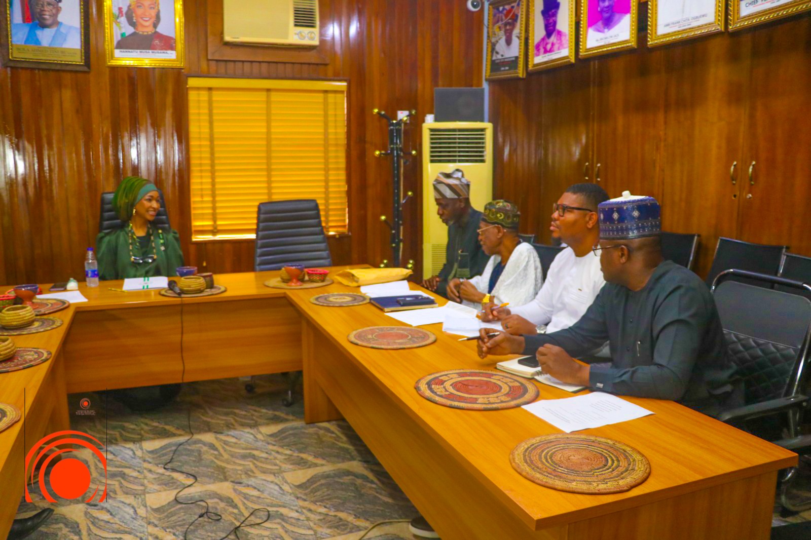 The Honourable Minister receiving the Central Committee across the conference table
