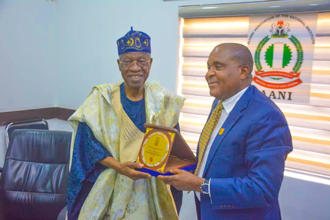 Amb. Okafor presenting Alhaji Lai Mohammed with a plaque from AANI